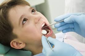 Child smiling in the dental chair