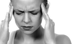 Person with a headache from jaw clenching