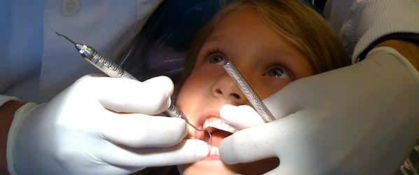 Child getting dental care in the dental chair