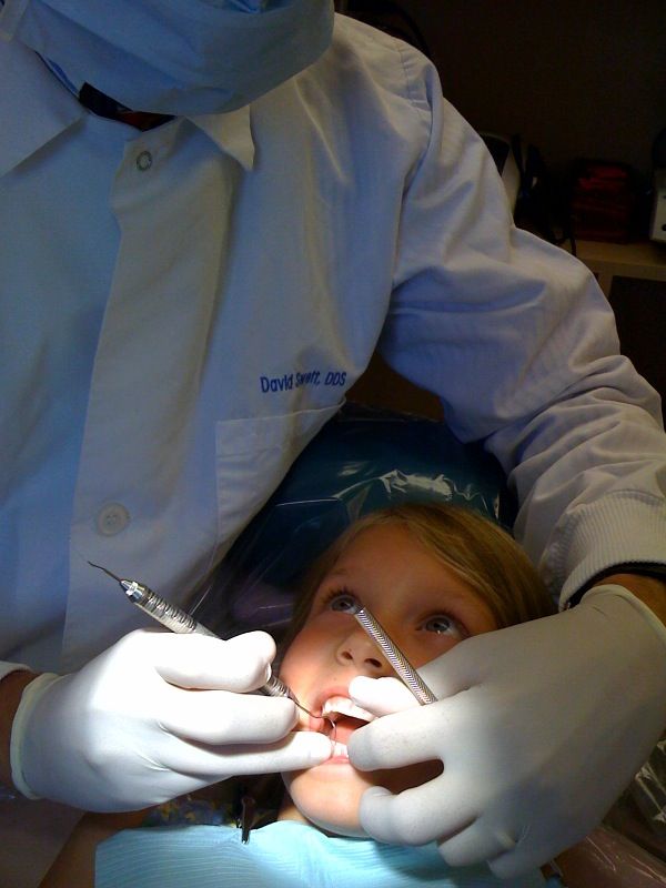 A child seated in the dental chair at Swett Dentistry